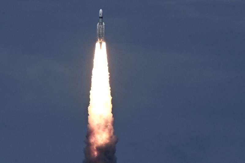 India launched a rocket on Friday carrying an unmanned spacecraft to land on the Moon