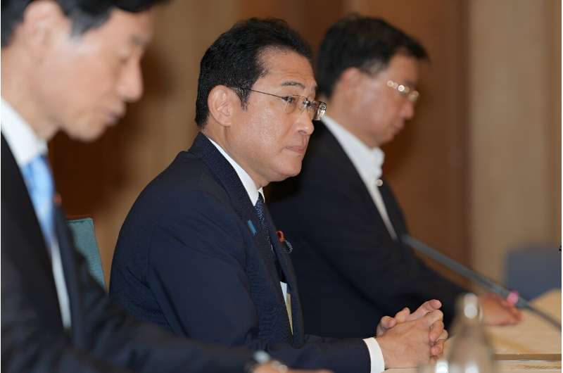 Japan's Prime Minister Fumio Kishida at a meeting with fisheries representatives before a decision about the release of treated 