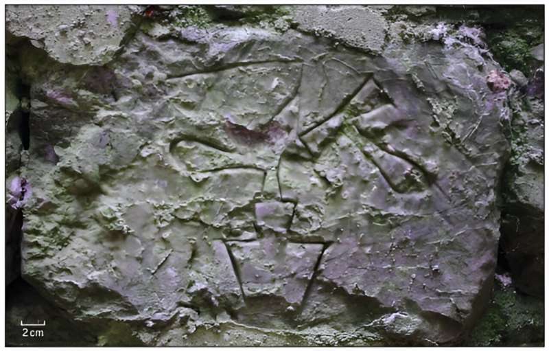 Late medieval to early modern stone engravings in castle dungeon created by prisoners