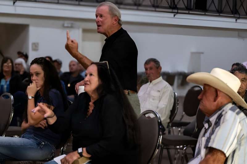 Louisiana resident Larry Louviere (C) confronts local officials about the saltwater intrusion in their drinking water, linked to drought conditions and low river levels