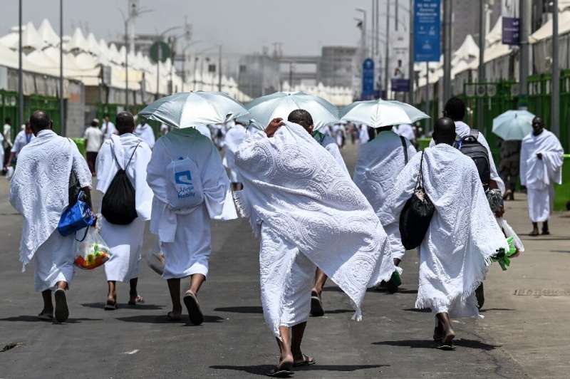 Many robed pilgrims walked from Mecca to Mina on Monday