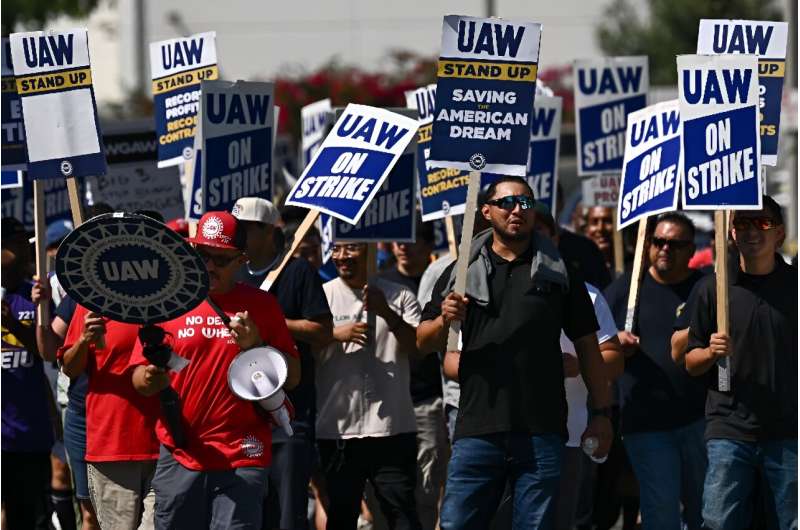 Members of the United Auto Workers Local 230 walk the picket line in front of the Chrysler Corporate Parts Division in Ontario, California, on September 26, 2023, in solidarity with &quot;Big Three&quot; autoworkers currently on strike