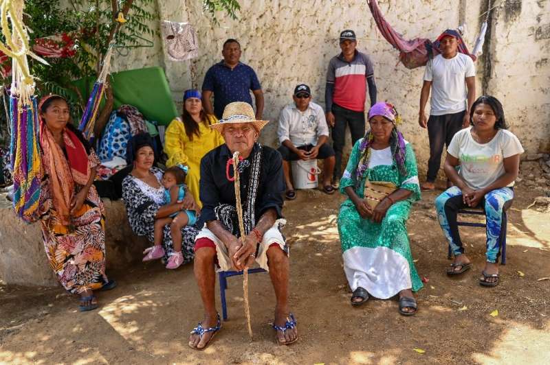 Moises Jusayu (C), a member of the Wayuu Indigenous community, says he has suffered violence and harassment since refusing to se