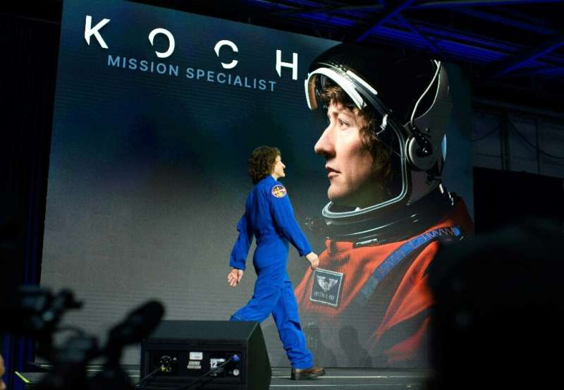 NASA astronaut Christina Koch takes the stage after being named to the Artemis II mission