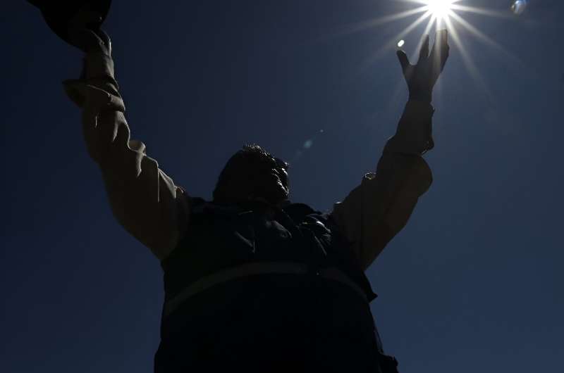 Pedro de la Cruz raises his arms to Pachamama (Mother Earth deity) and prays for rain