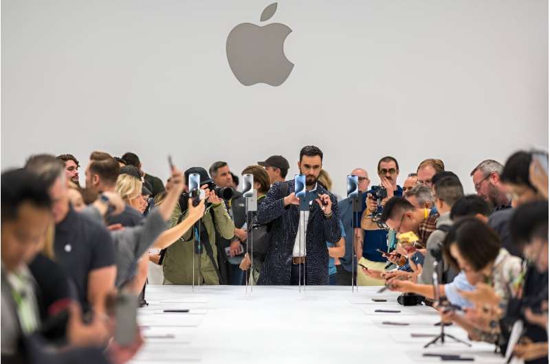 People gather to look at the Apple iPhone 15 Pro during a launch event at Apple Park in Cupertino