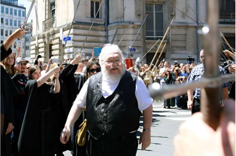 &quot;Game of Thrones&quot; author George RR Martin arrives to attend a book signing in France in 2014, awaited by more than a thousand fans
