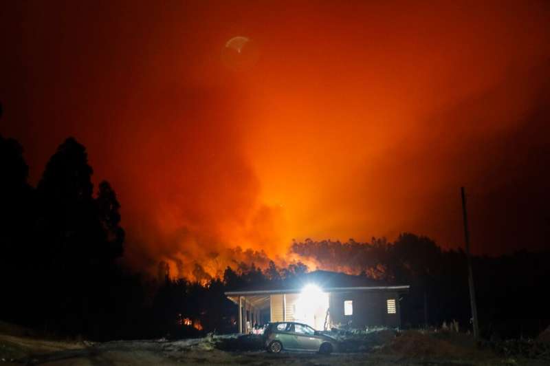 Raging forest fires light up night skies over Santa Juana, Chile on February 3, 2023; it is one of the cities hardest-hit by a s