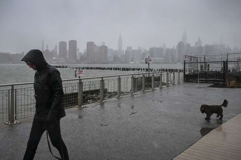 Rain and snow pummeled New York City as a storm gripped the US East Coast