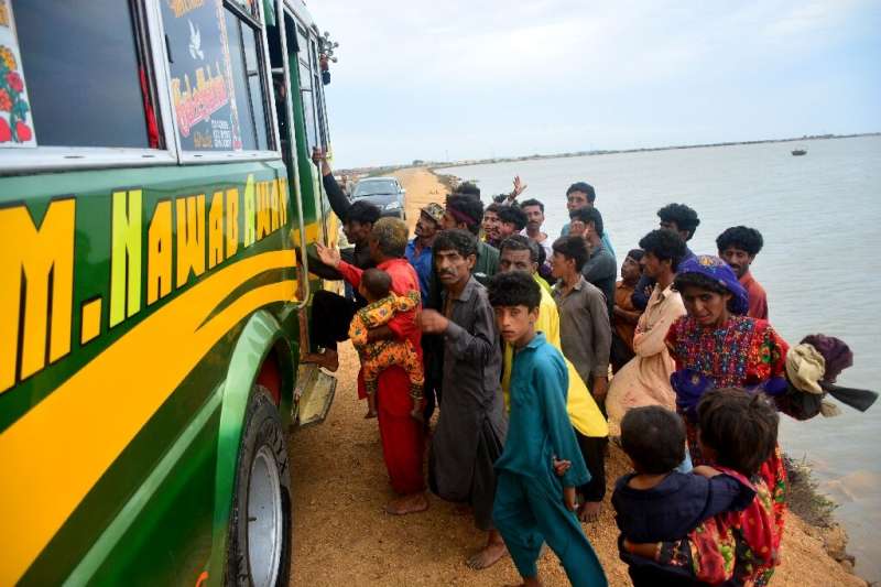 Residents evacuate a coastal area of Keti Bandar in Pakistan's Sindh province