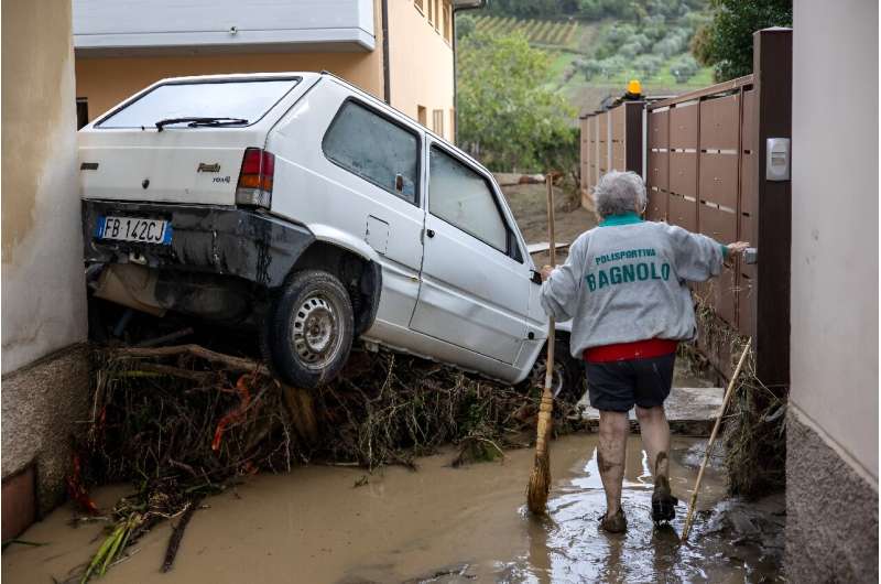 Residents in Tuscany Residents were busy Friday mucking out homes, garages and cellars swamped by the floodwaters