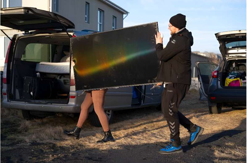 Residents of Grindavik grab their belongings as they evacuate due to the looming threat of a volcanic eruption