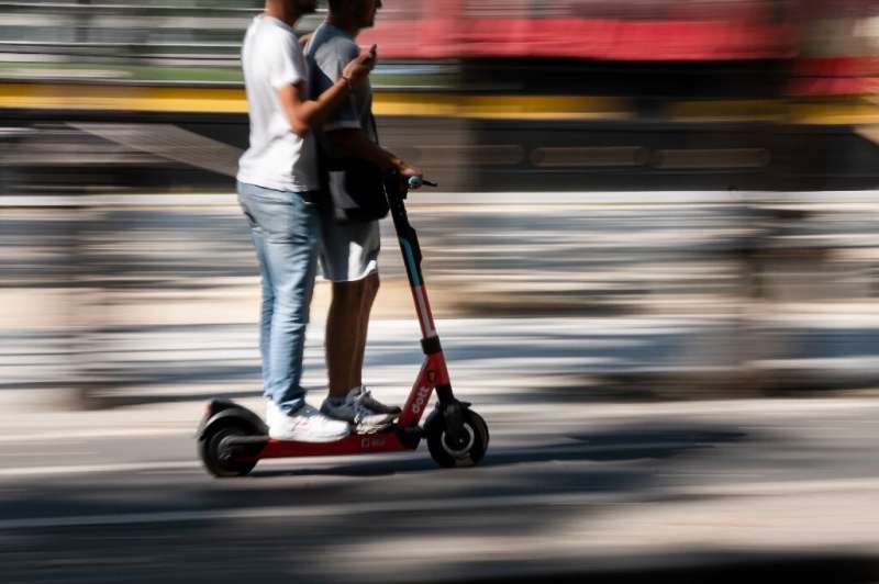Riding e-scooters with others is illegal but common on the streets of Paris