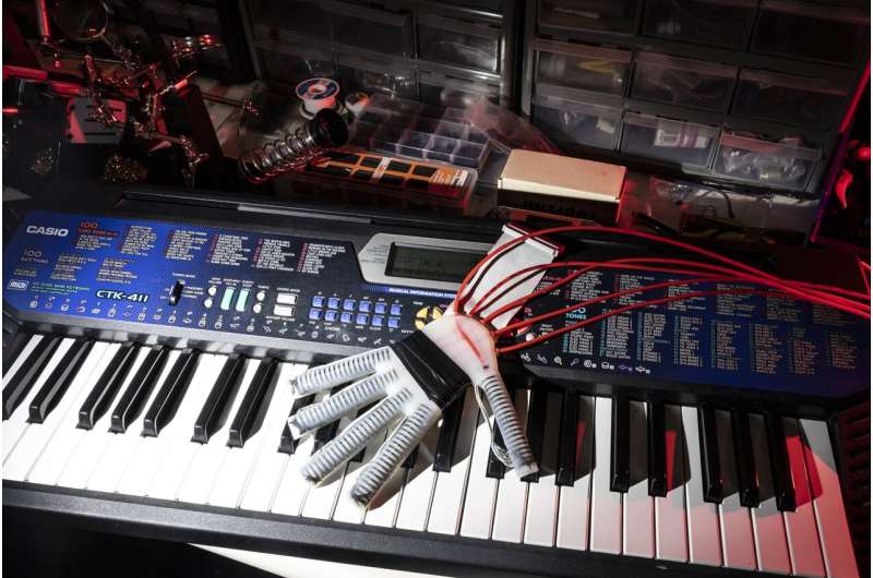 Robotic glove that 'feels' lends a 'hand' to relearn playing piano after a stroke