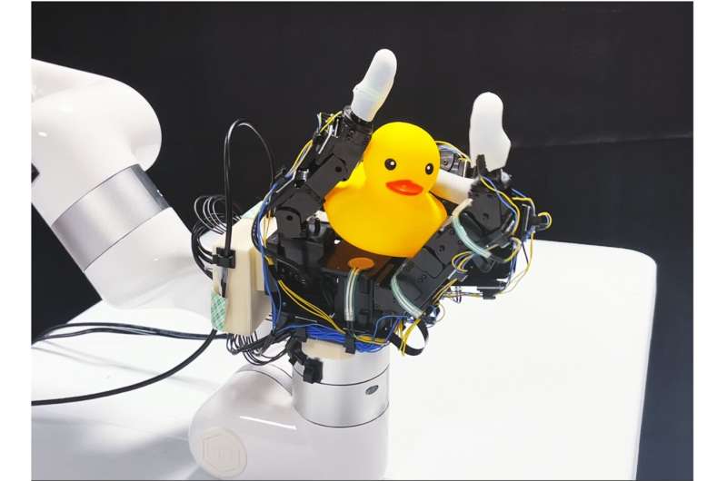 Robotic hand rotates objects using touch, not vision