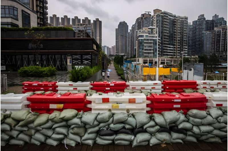 Sand bags are placed to stop flooding by the waterfront at Tseung Kwan O in Hong Kong as Super Typhoon Saola barrelled towards C