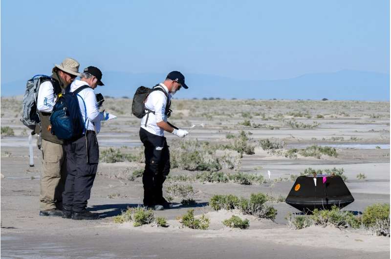 Scientists collect data shortly after the sample return capsule from NASA's Osiris-Rex mission landed in Dugway, Utah