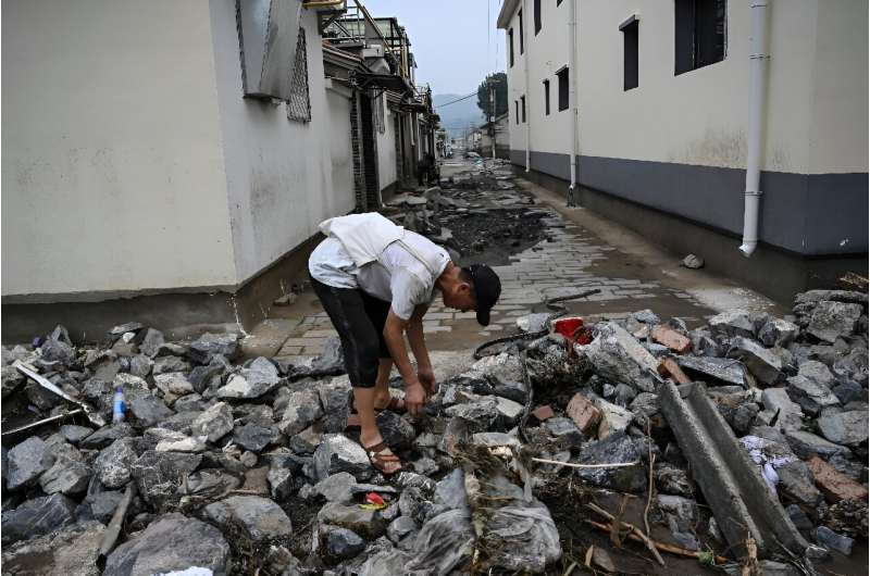 Scores have died in the floods across northern China