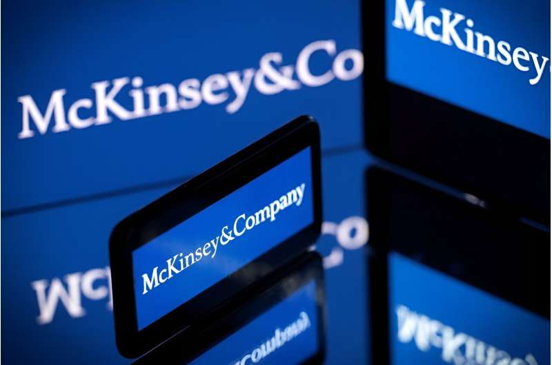 Screens displaying the logo of US-based McKinsey &amp; Company, the world's top management consulting firm