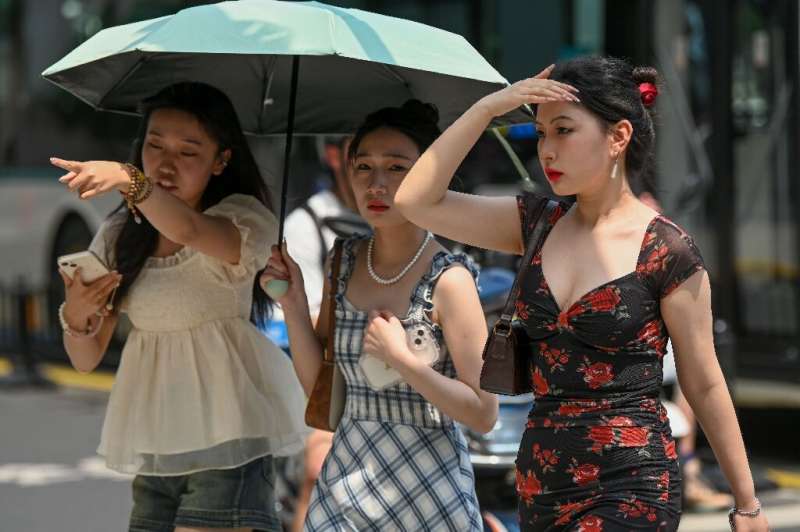 Shanghai residents swelter as China's largest city records its hottest May day in 100 years of 36.1 degrees Celsius (97 degrees 