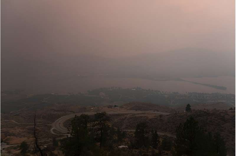Smoke hangs over the town of Osoyoos in the province of British Columbia on August 18, 2023