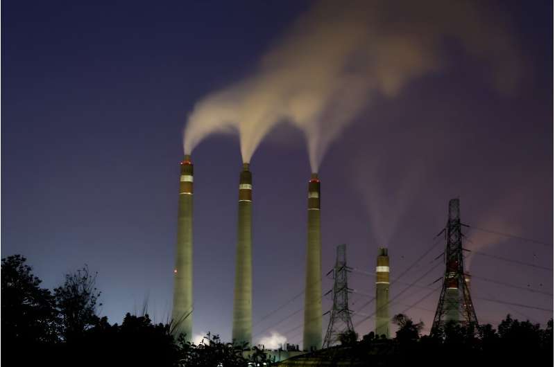 Smoke rises from the chimneys of the Suralaya coal-fired power plant in Cilegon on September 14, 2023