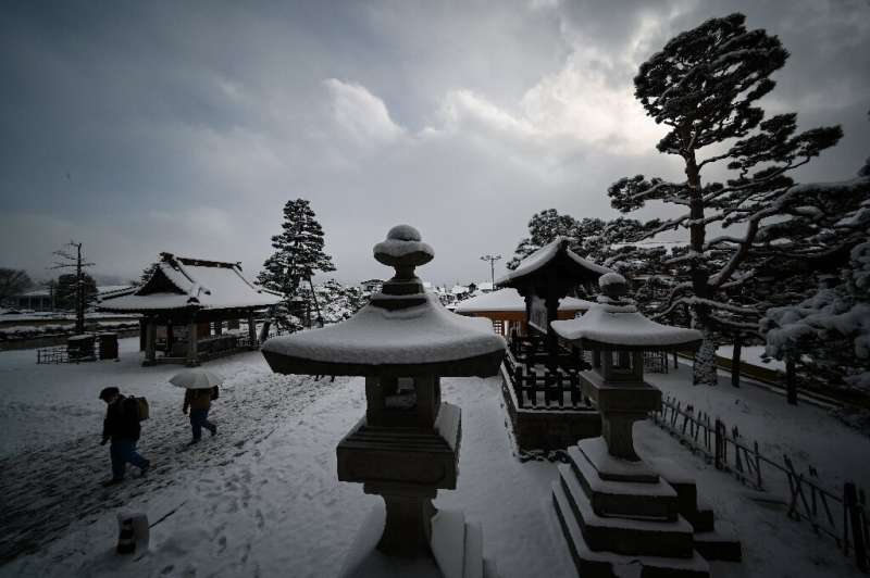 Snow covered popular tourists sites across parts of Japan