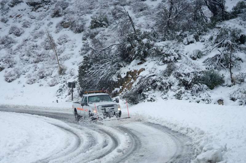 Snow has snarled mountain roads around southern California, as a brutal, and unusual, winter storm grips the area