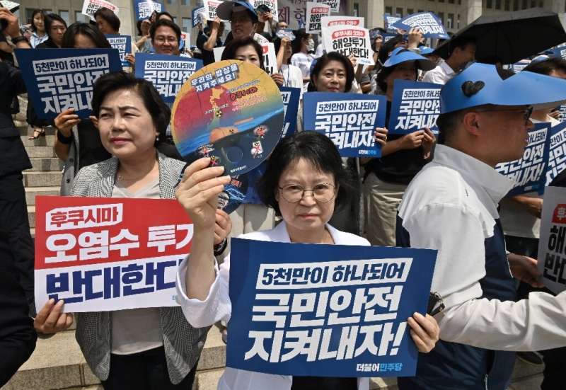 South Korean opposition lawmakers and party members protest Japan's plan to release treated water from the Fukushima nuclear pla
