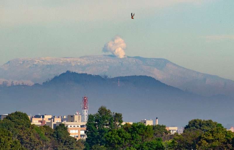 The 5,300-meter (17,400-foot) Nevado del Ruiz volcano emits a cloud of ash as seen from Bogota, on May 18, 2023.