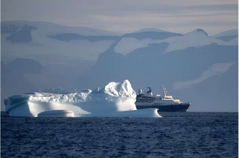 The cruise ship &quot;Ocean  Adventurer&quot; sails between icebergs on Greenland's Scoresby Sound