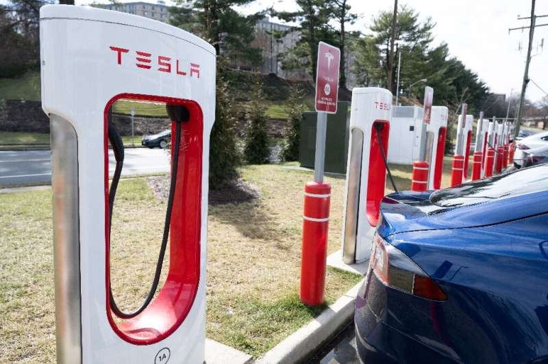 The embrace of Tesla's electric vehicle charging network has raised questions about whether it will supplant a rival system and 