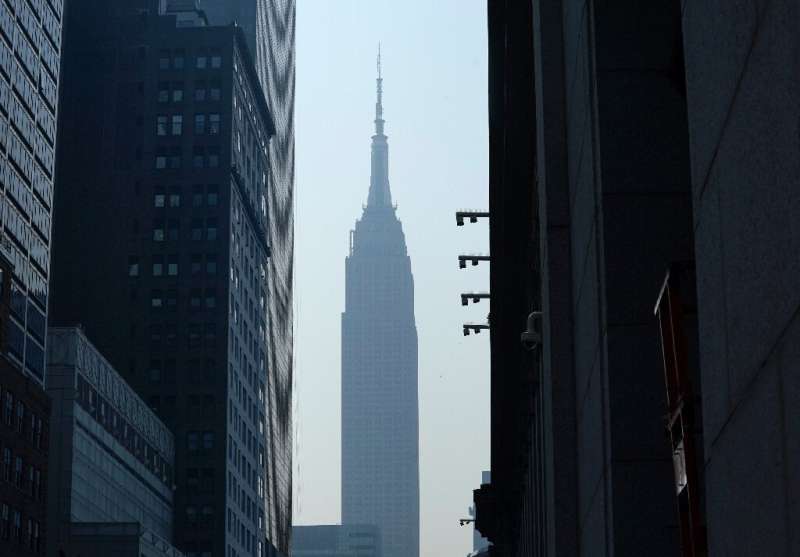 The Empire State Building in New York seen through smoke