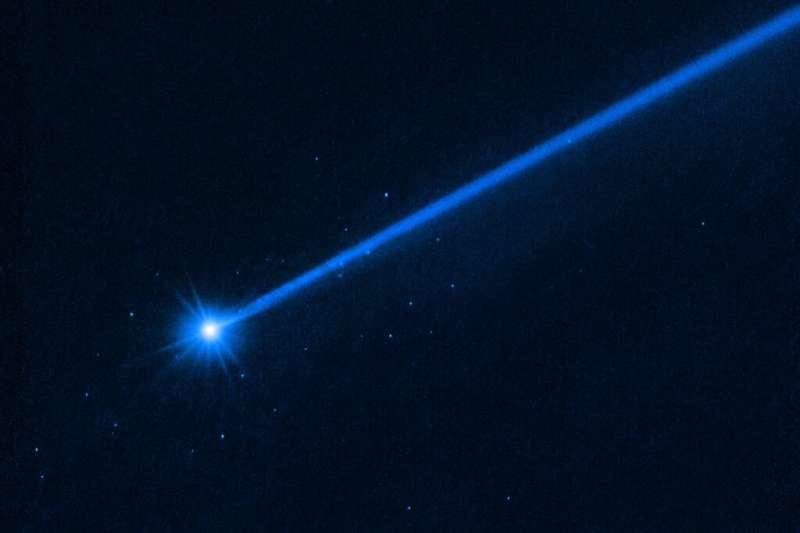 The small spots of light around the asteroid Dimorphos are boulders sent off by the impact of the NASA probe, a Hubble telescope