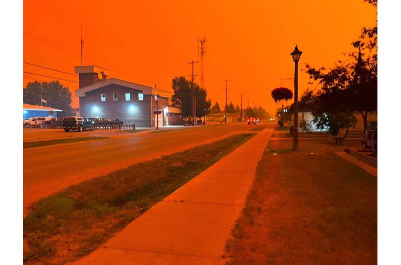 The town of Fort Smith in an orange haze as wildfires sweep Canada's far north