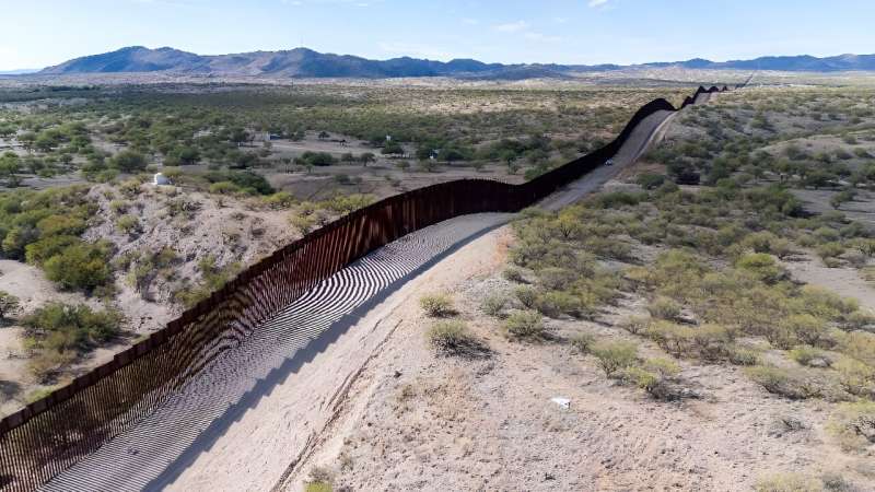 This aerial picture taken on December 8, 2023 shows the US-Mexico border wall in Sasabe, Arizona