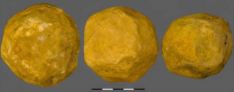 Three limestone &quot;spheroids&quot; from the 'Ubeidiya site in Israel, which researchers believe were deliberately made into s
