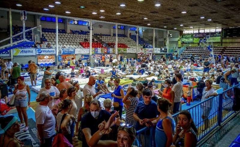 Tourists find refuge from the fires in a gynasium on Rhodes