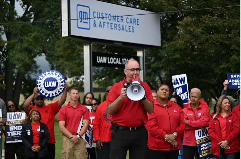 UAW President Shawn Fain addresses picketing members at a General Motors service parts operations plant in Belleville, Michigan on September 26, 2023