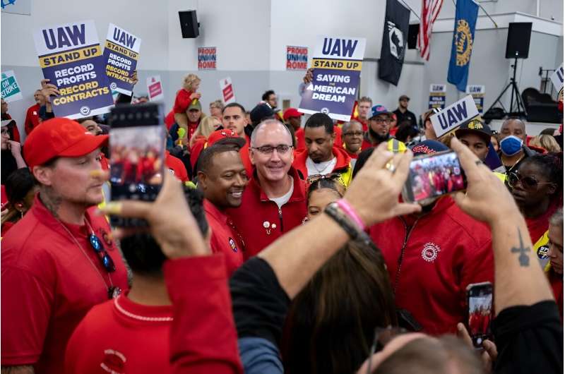 UAW President Shawn Fain greeted members attending a rally in support of the labor union strike last month in Chicago