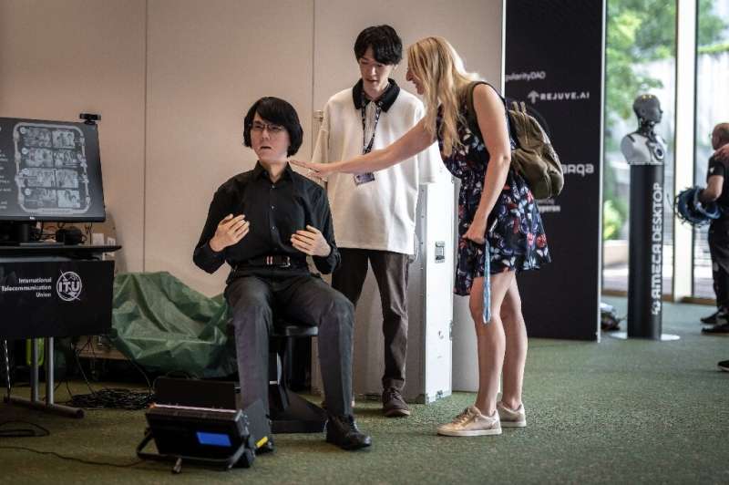Visitors interacted with Geminoid HI-2, a tele-operated android created by Hiroshi Ishiguro Laboratories