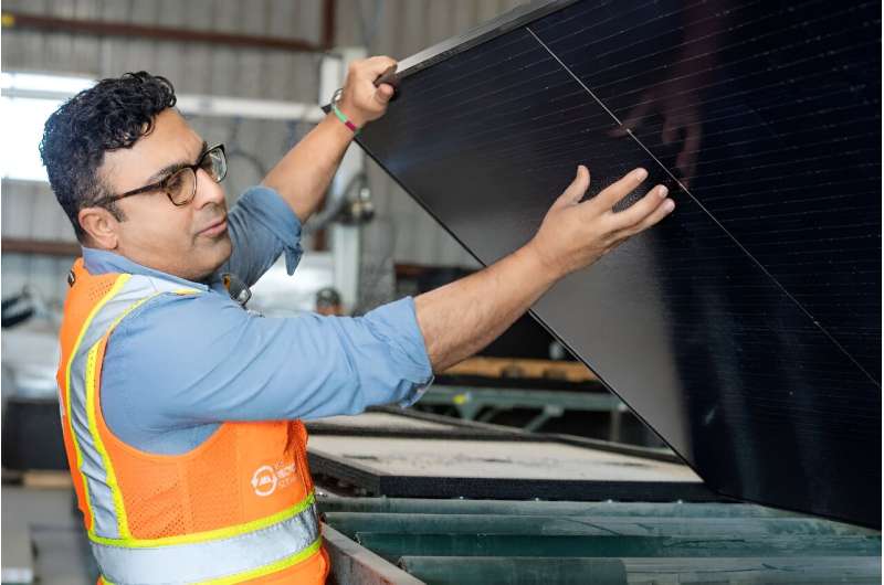We Recycle Solar CEO Adam Saghei shows damaged solar panels to be recycled at a plant in Yuma, Arizona