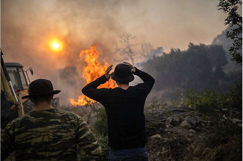 Wildfires have been raging in Greece amid scorching temperatures, forcing mass evacuations in several tourist spots including on