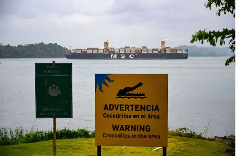 A cargo ship passes through the Panama Canal