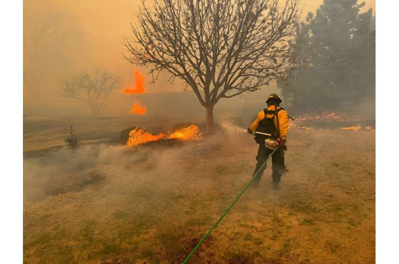 A firefighter battling the Smokehouse Creek Fire, near Amarillo, in the Texas Panhandle