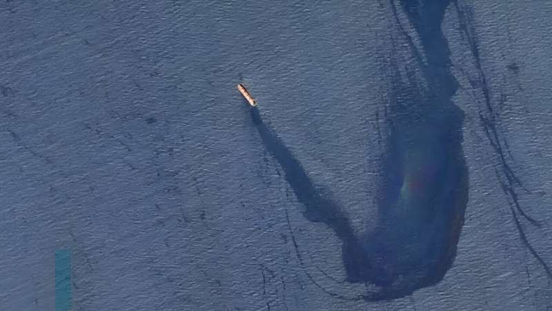A handout picture released by the US Central Command (CENTCOM) on February 23, 2024, shows the M/V Rubymar, a Belize-flagged, UK-owned bulk carrier leaking oil in the Gulf of Aden after taking significant damage after an attack Huthi rebels