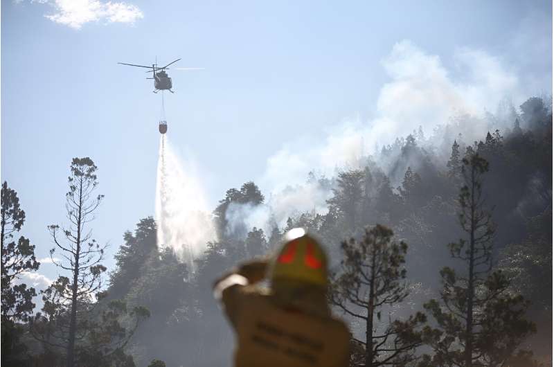 A helicopter combating a forest fireat Los Alerces National Park in the Argentine province of Chubut, in Patagonia,January 26, 2024