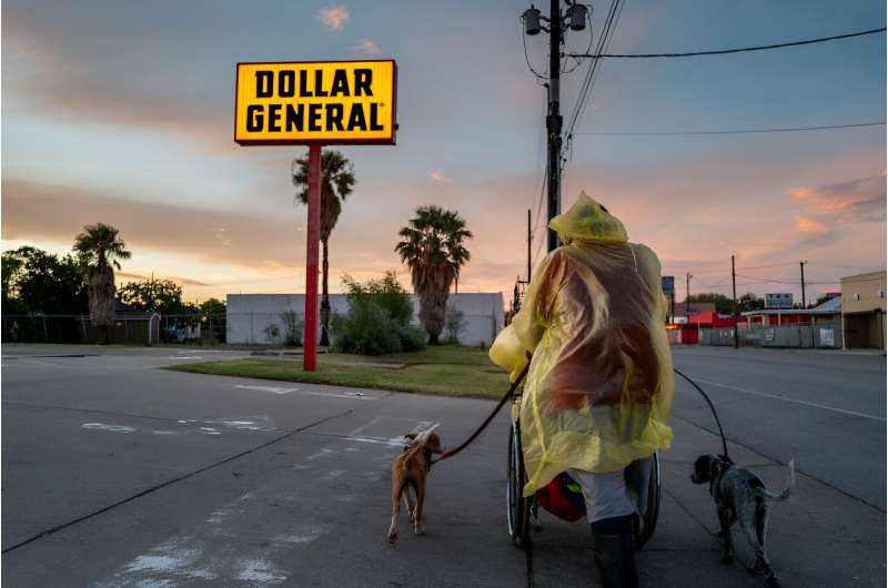 A homeless couple prepares to seek shelter on July 7, 2024, ahead of Beryl's arrival in Corpus Christi, Texas