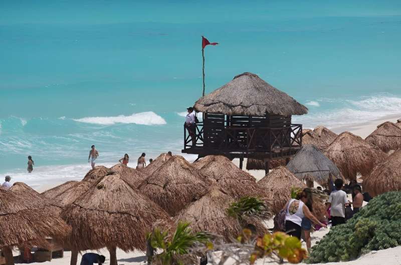 A lifeguard is seen ahead of the potential arrival of Hurricane Beryl in Cancun, Mexico on July 3, 2024