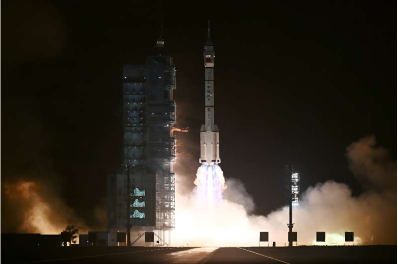 A Long March-2F carrier rocket, carrying the Shenzhou-18 spacecraft and a crew of three astronauts, lifts off from the Jiuquan Satellite Launch Center